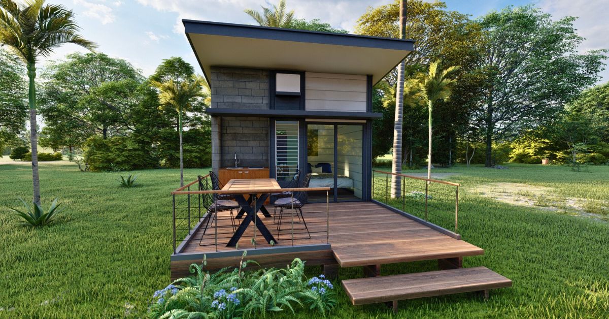 tiny home with wood deck and roof with composite shingles