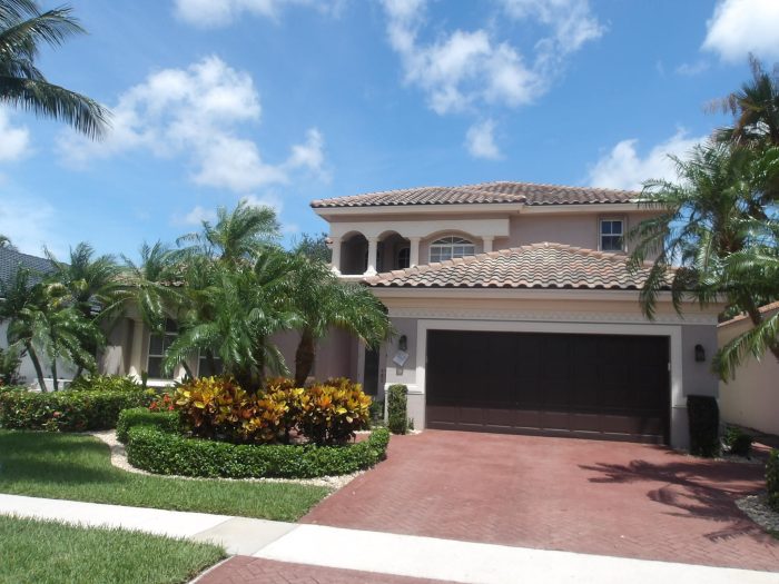 Clay barrel tile roof profile and color on a South Florida home