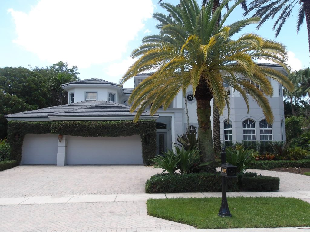 Spanish clay tile re-roof completed by Caldwell Roofing on a South Florida home