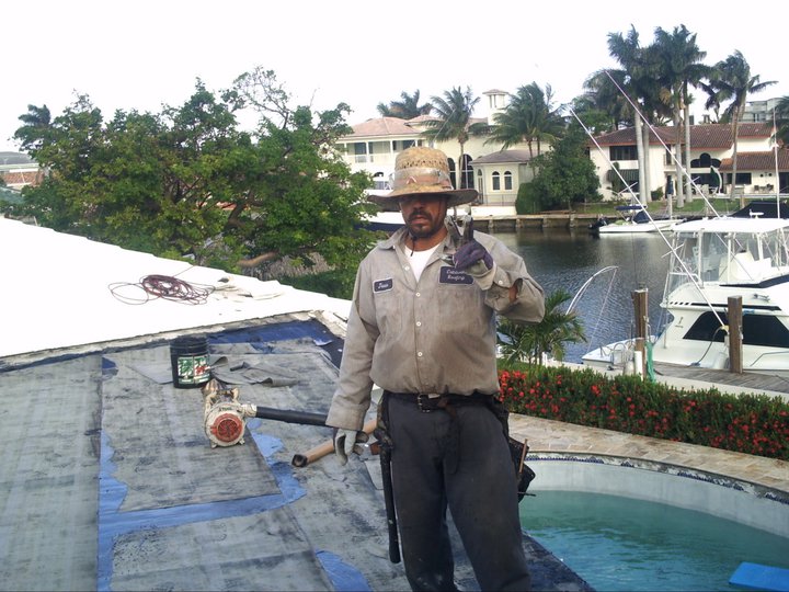 Caldwell Roofing crew member on a South Florida re-roof in progress